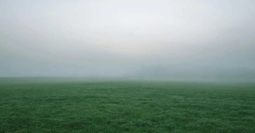 Fog obscuring the horizon over open water