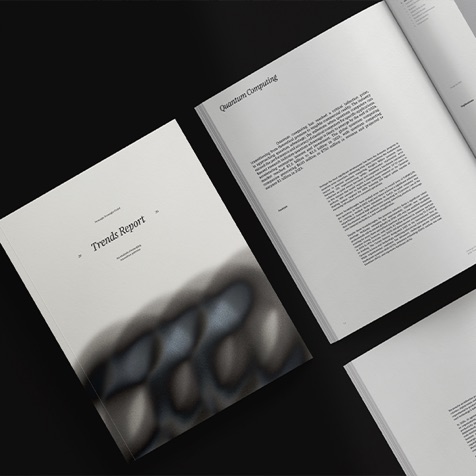 Printed trends report open on a dark surface